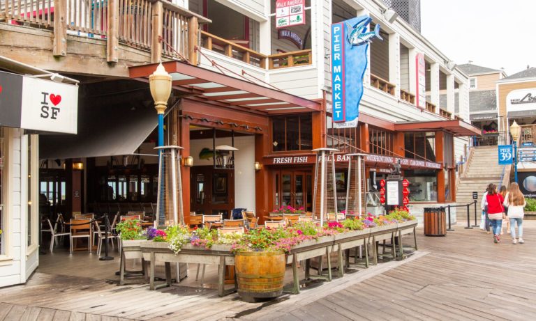 The welcoming entrance and outdoor patio at Pier Market