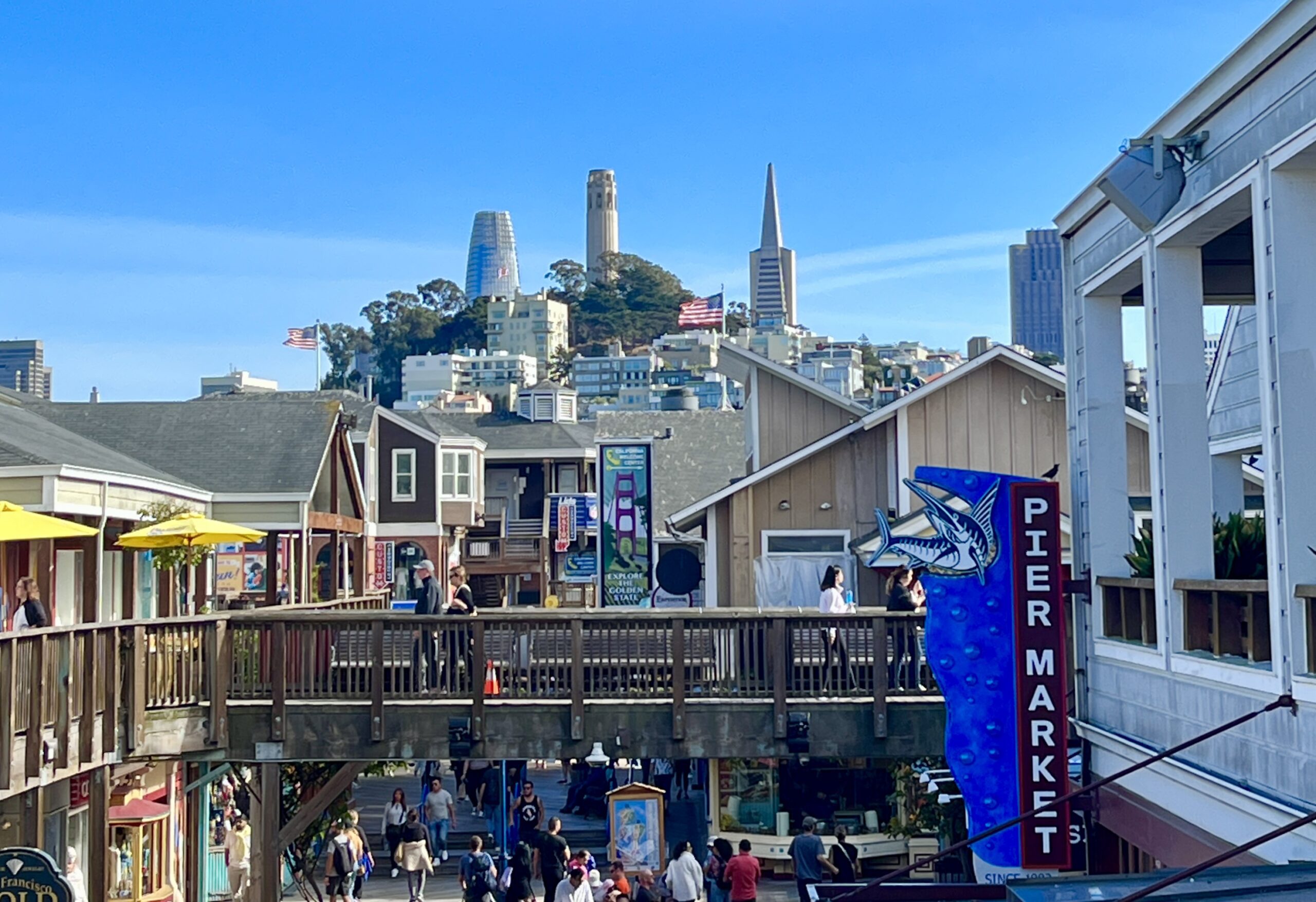 Coit Tower and Pier Market Seafood Restaurant seen from Pier 39