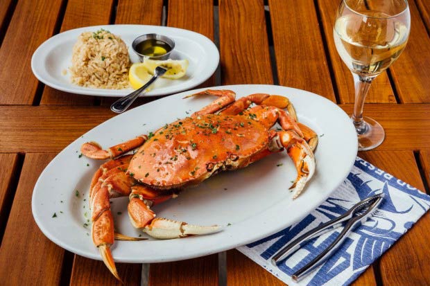 Dungeness crab served with white wine.